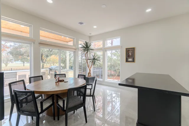a view of a dining room with furniture window and outside view