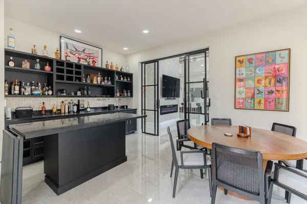 a open kitchen with stainless steel appliances granite countertop a stove and a refrigerator