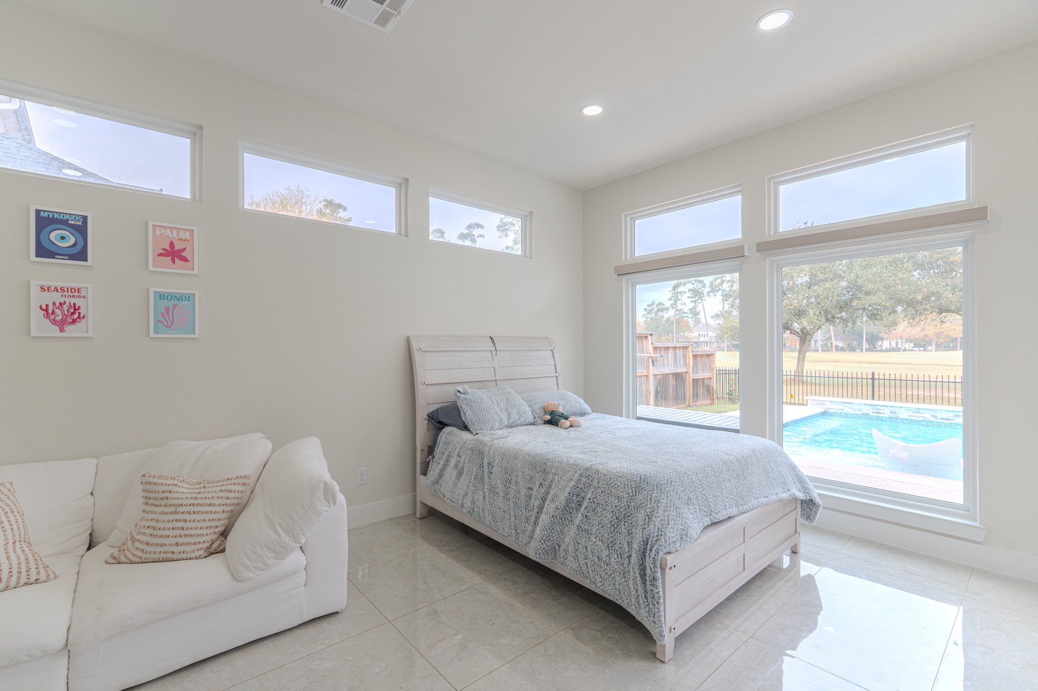 6510 Sussex Court Spring, TX 77389 - Photo 26 of 47 a bedroom with a large bed and a couch