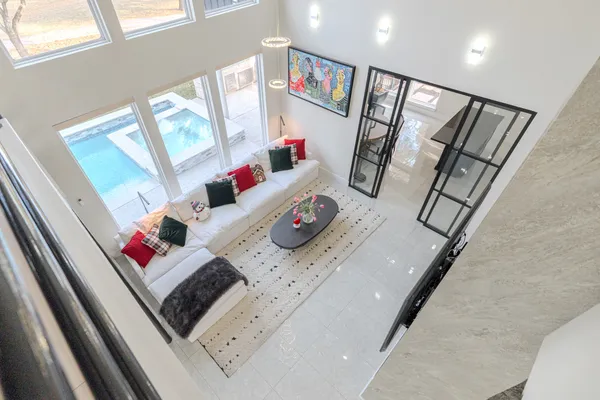 a living room with furniture and a potted plant