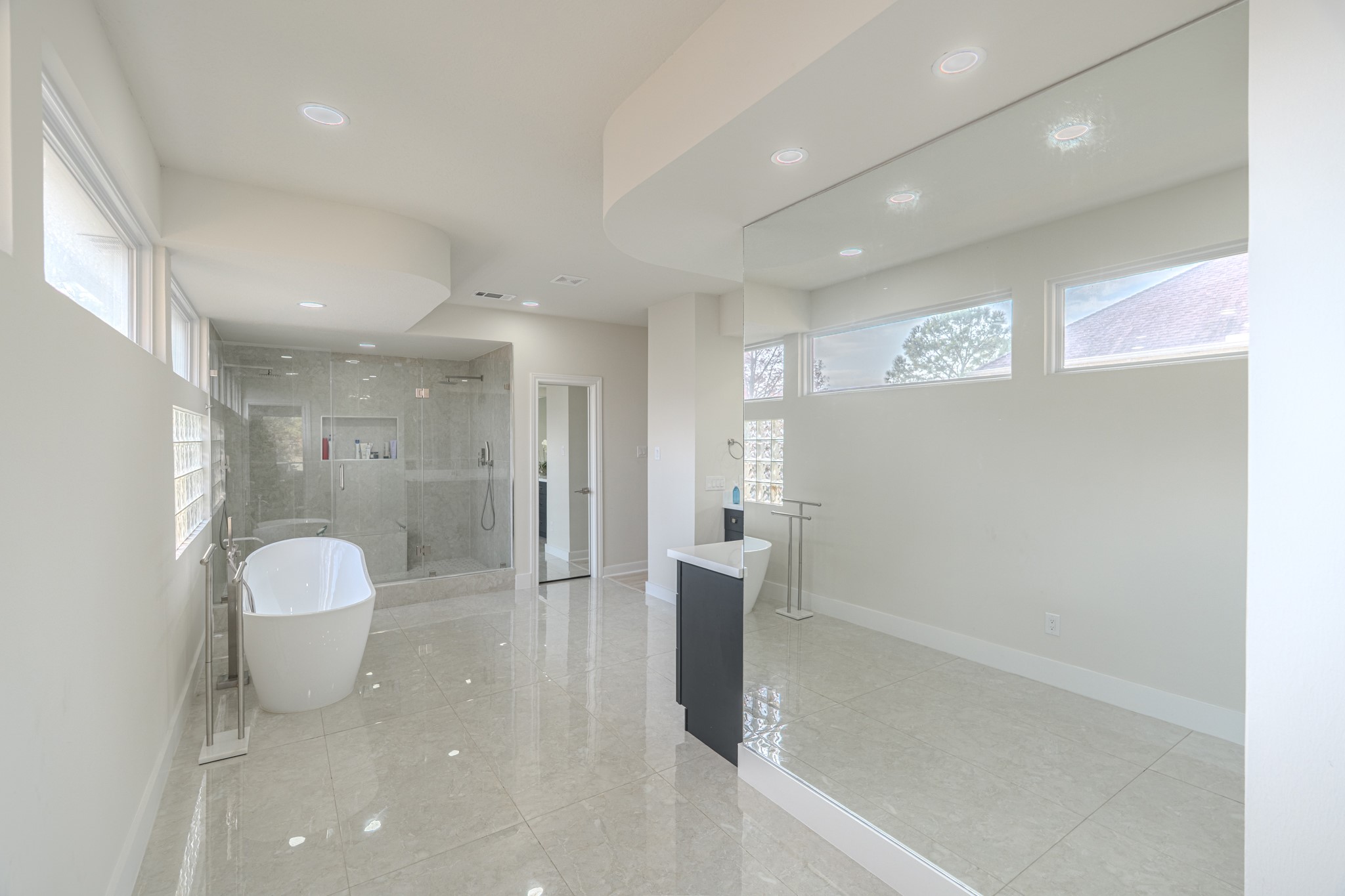6510 Sussex Court Spring, TX 77389 - Photo 34 of 47 a bathroom with a granite countertop sink a toilet and shower