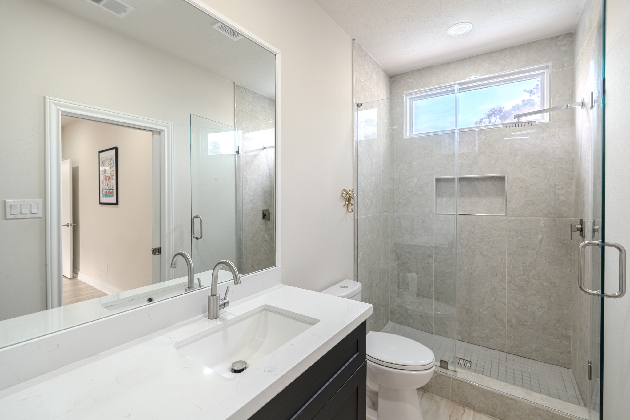 6510 Sussex Court Spring, TX 77389 - Photo 39 of 47 a bathroom with a sink a toilet and shower