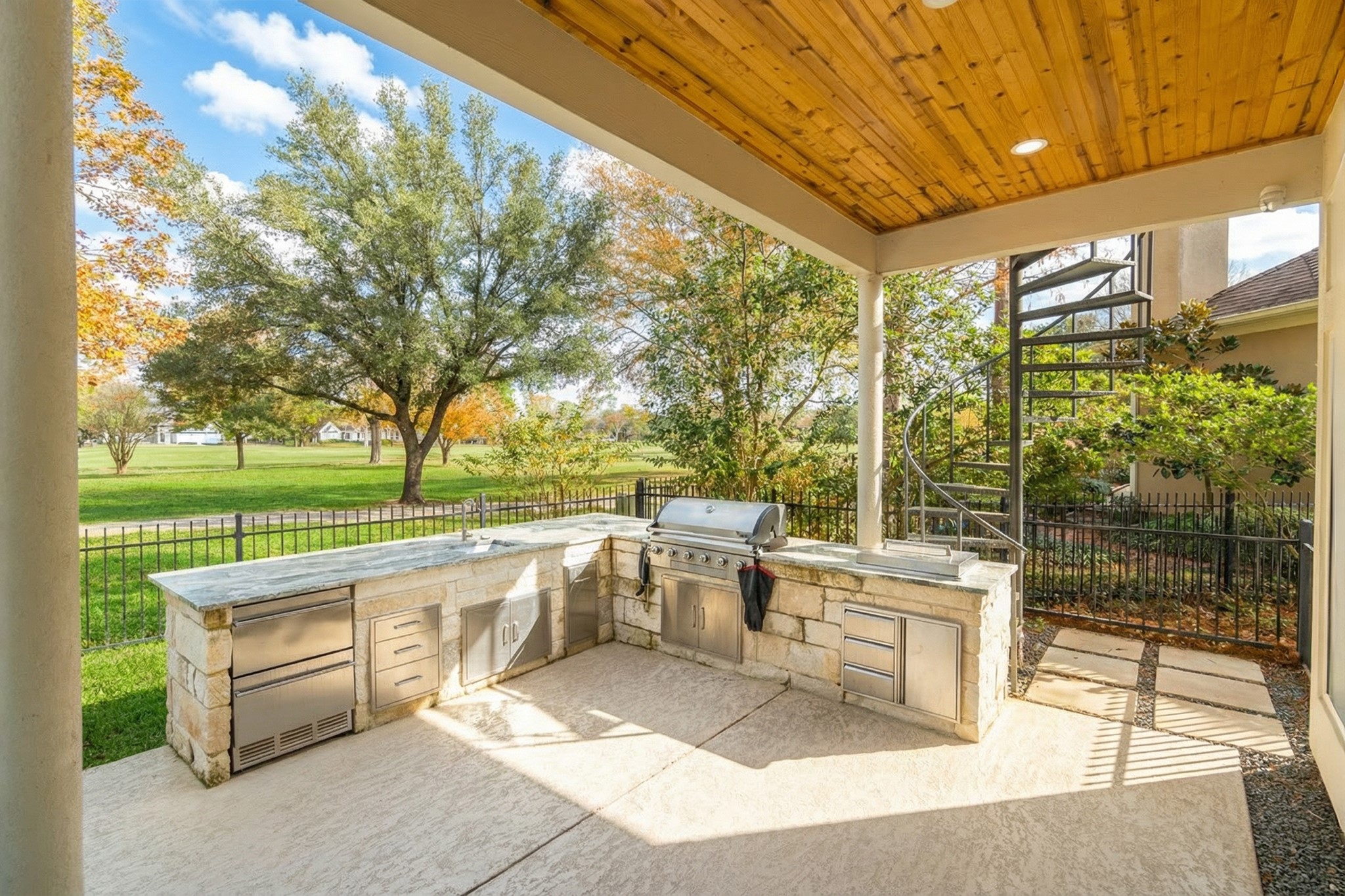 6510 Sussex Court Spring, TX 77389 - Photo 43 of 47 a view of a patio with couches and table and chairs and floor to ceiling window