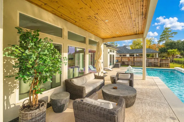 a building outdoor space with patio furniture and potted plants