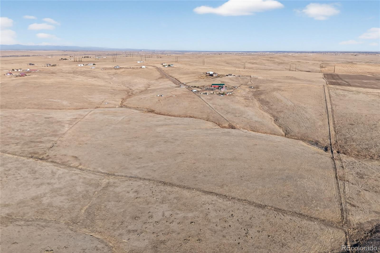 5689 South Tom Bay Road Bennett, CO 80102 - Photo 11 of 19 a view of an ocean beach