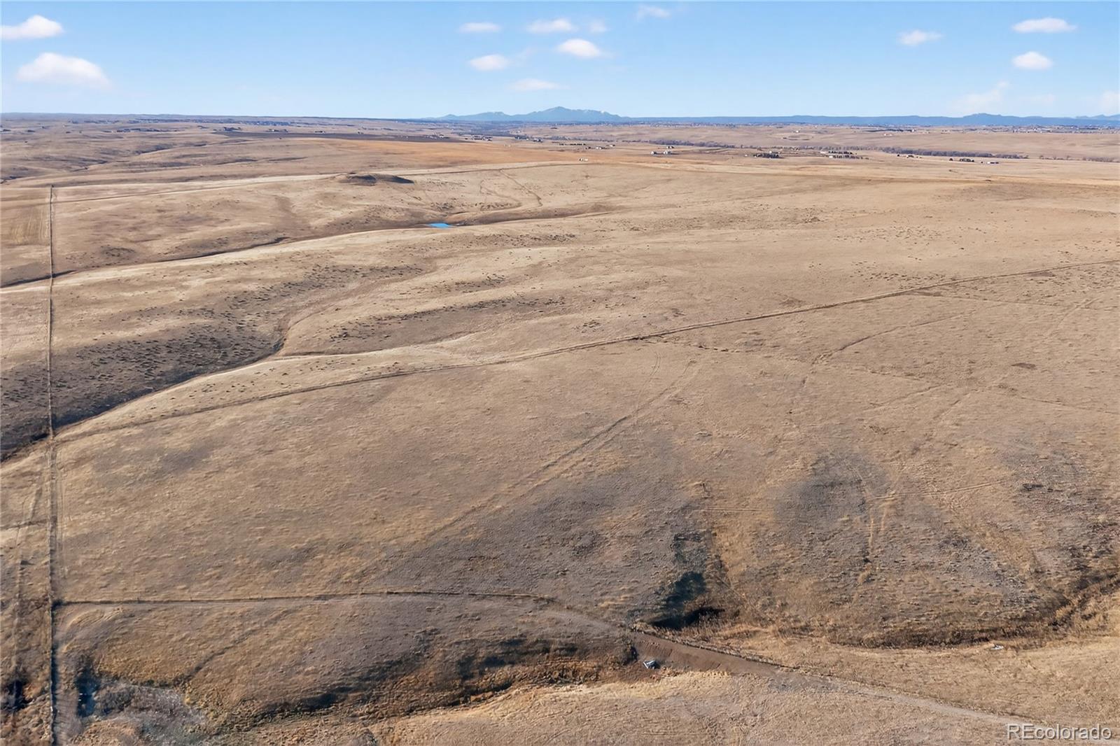5689 South Tom Bay Road Bennett, CO 80102 - Photo 14 of 19 a view of beach and ocean