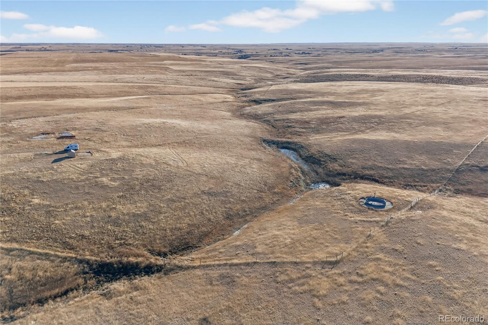 5689 South Tom Bay Road Bennett, CO 80102 - Photo 17 of 19 a view of a walk in the ocean