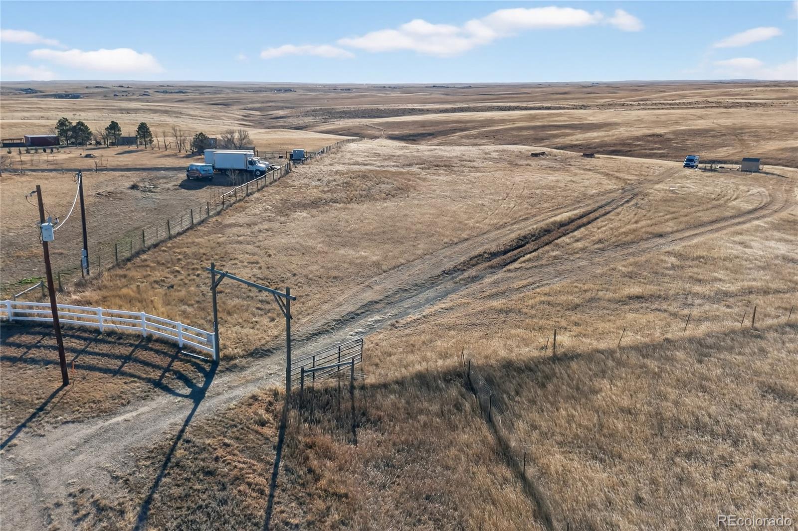5689 South Tom Bay Road Bennett, CO 80102 - Photo 3 of 19 a view of an ocean and beach