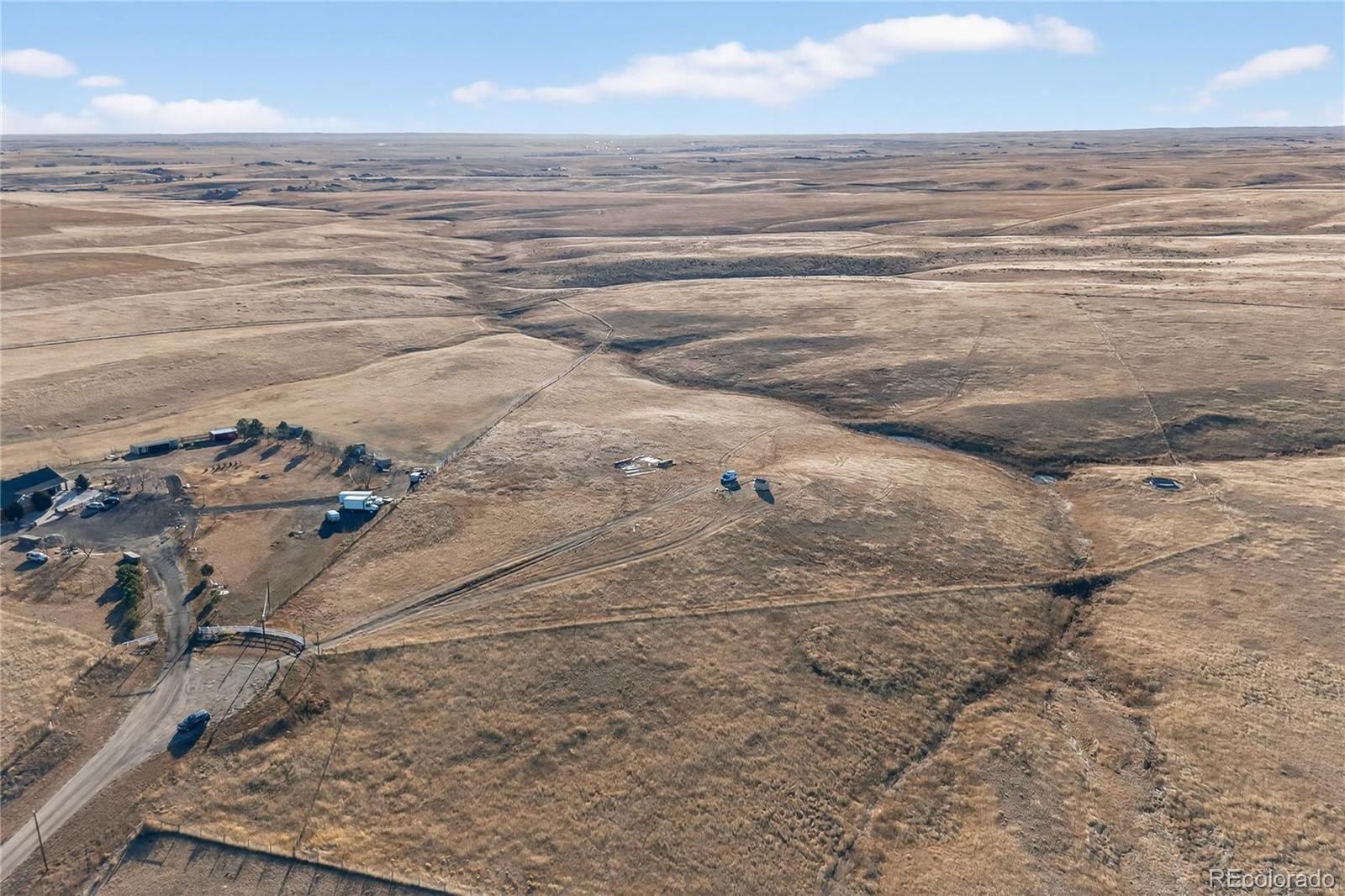 5689 South Tom Bay Road Bennett, CO 80102 - Photo 8 of 19 a view of beach and ocean