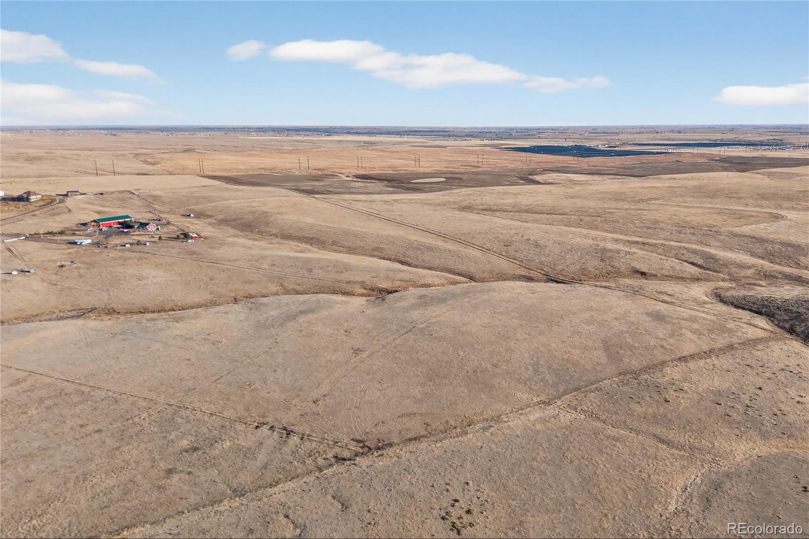 5689 South Tom Bay Road Bennett, CO 80102 - Photo 10 of 19 a view of an ocean and beach