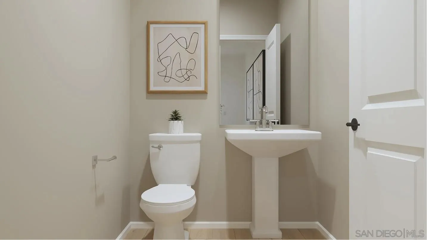 351 Beaker Road San Marcos, CA 92078 - Photo 9 of 10 a bathroom with a toilet sink and mirror