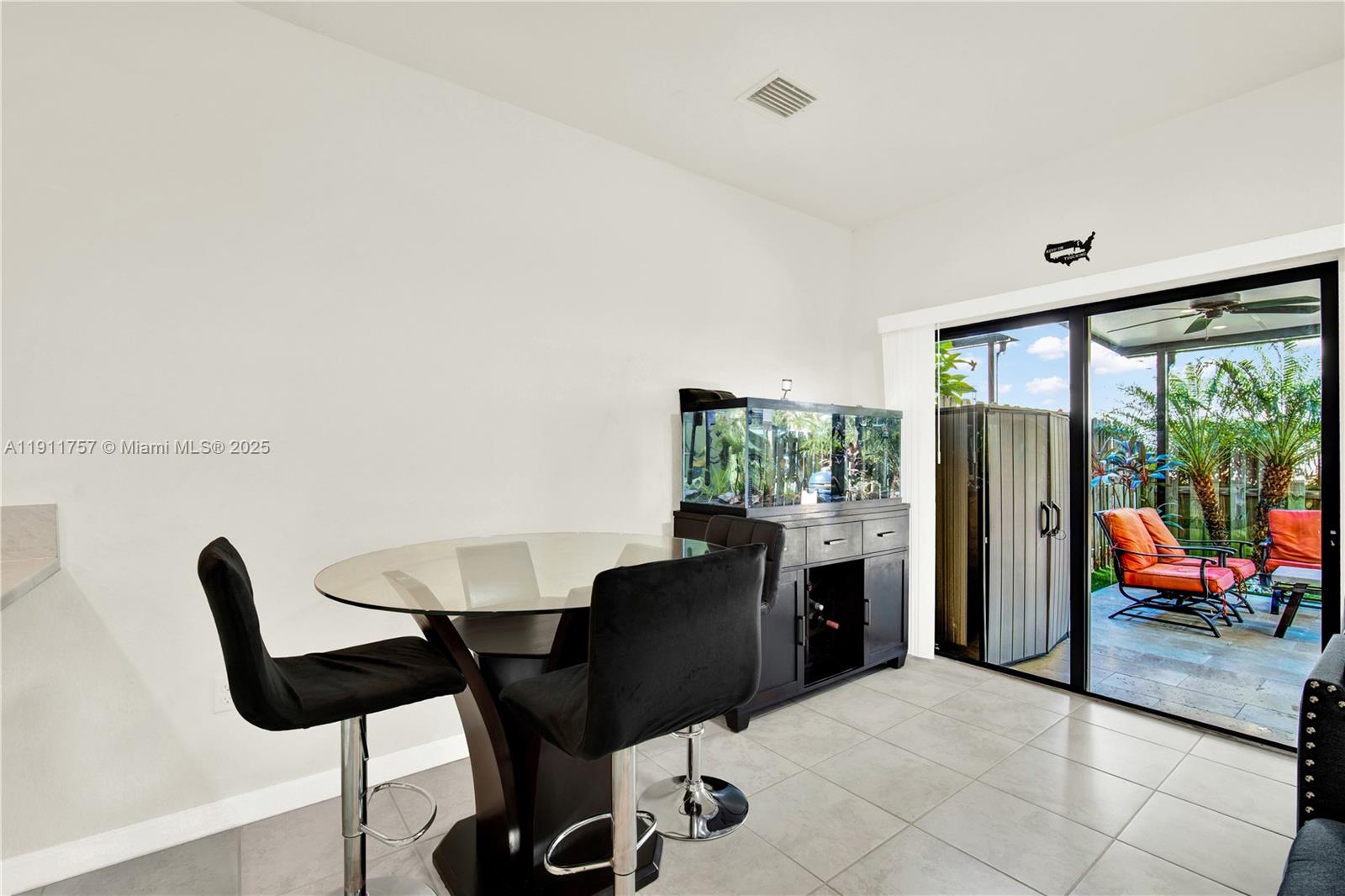11411 Southwest 248th Lane Homestead, FL 33032 - Photo 11 of 40 a view of a dining room with furniture window and outside view