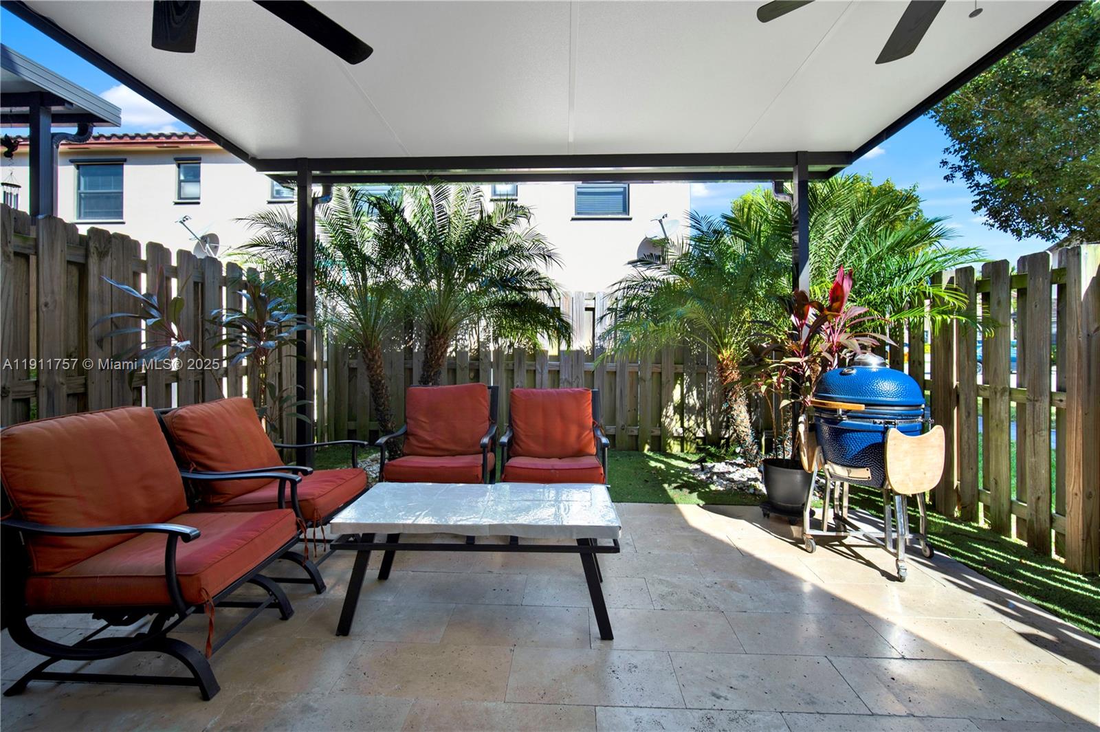 11411 Southwest 248th Lane Homestead, FL 33032 - Photo 15 of 40 a outdoor living space with patio furniture and a potted plant
