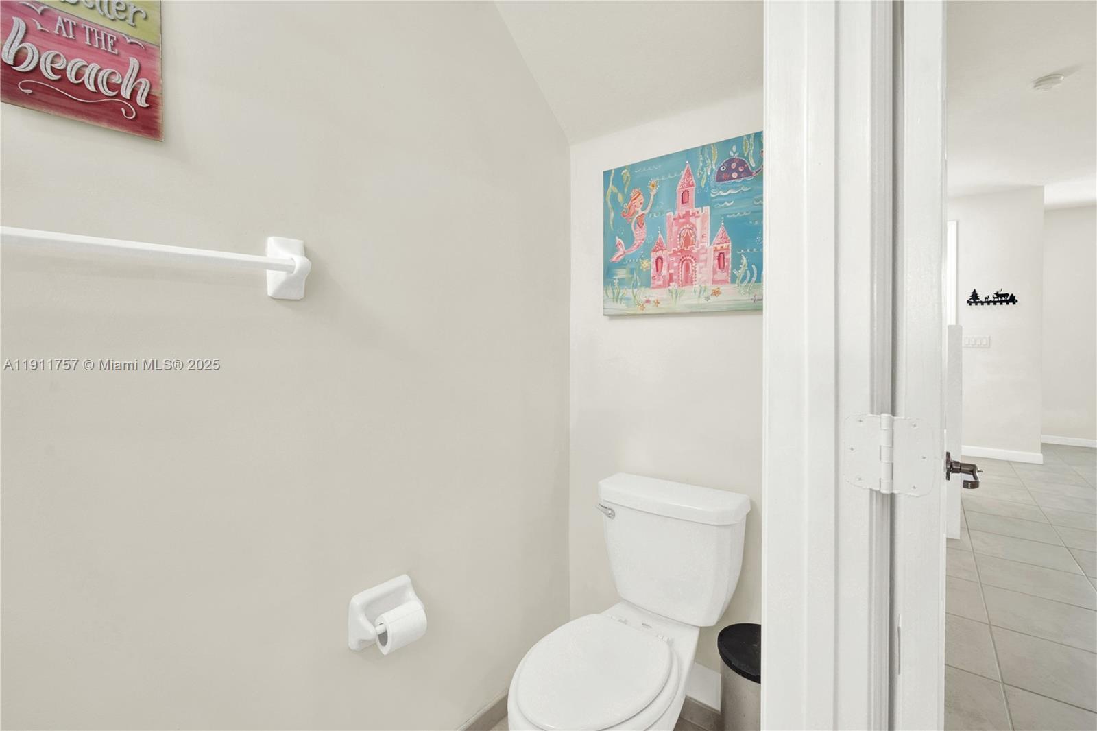 11411 Southwest 248th Lane Homestead, FL 33032 - Photo 18 of 40 a white toilet sitting next to a bathroom sink