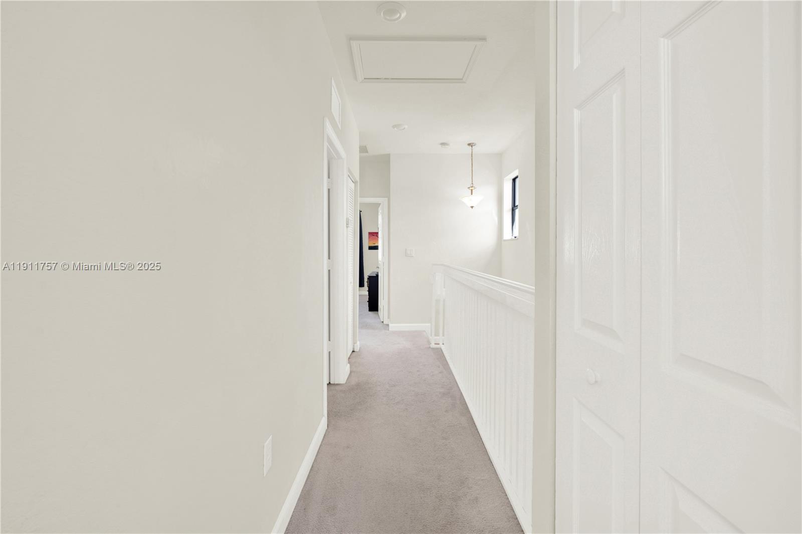 11411 Southwest 248th Lane Homestead, FL 33032 - Photo 19 of 40 a view of a hallway with a white walls