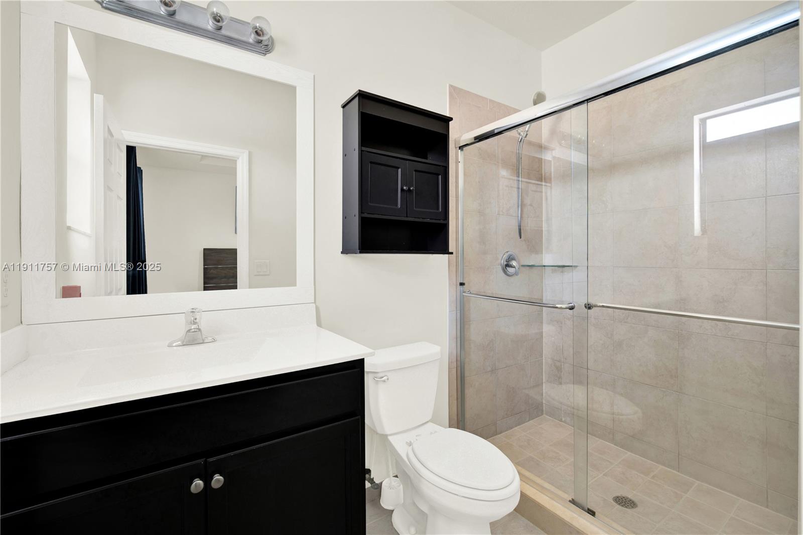 11411 Southwest 248th Lane Homestead, FL 33032 - Photo 21 of 40 a bathroom with a sink and a mirror