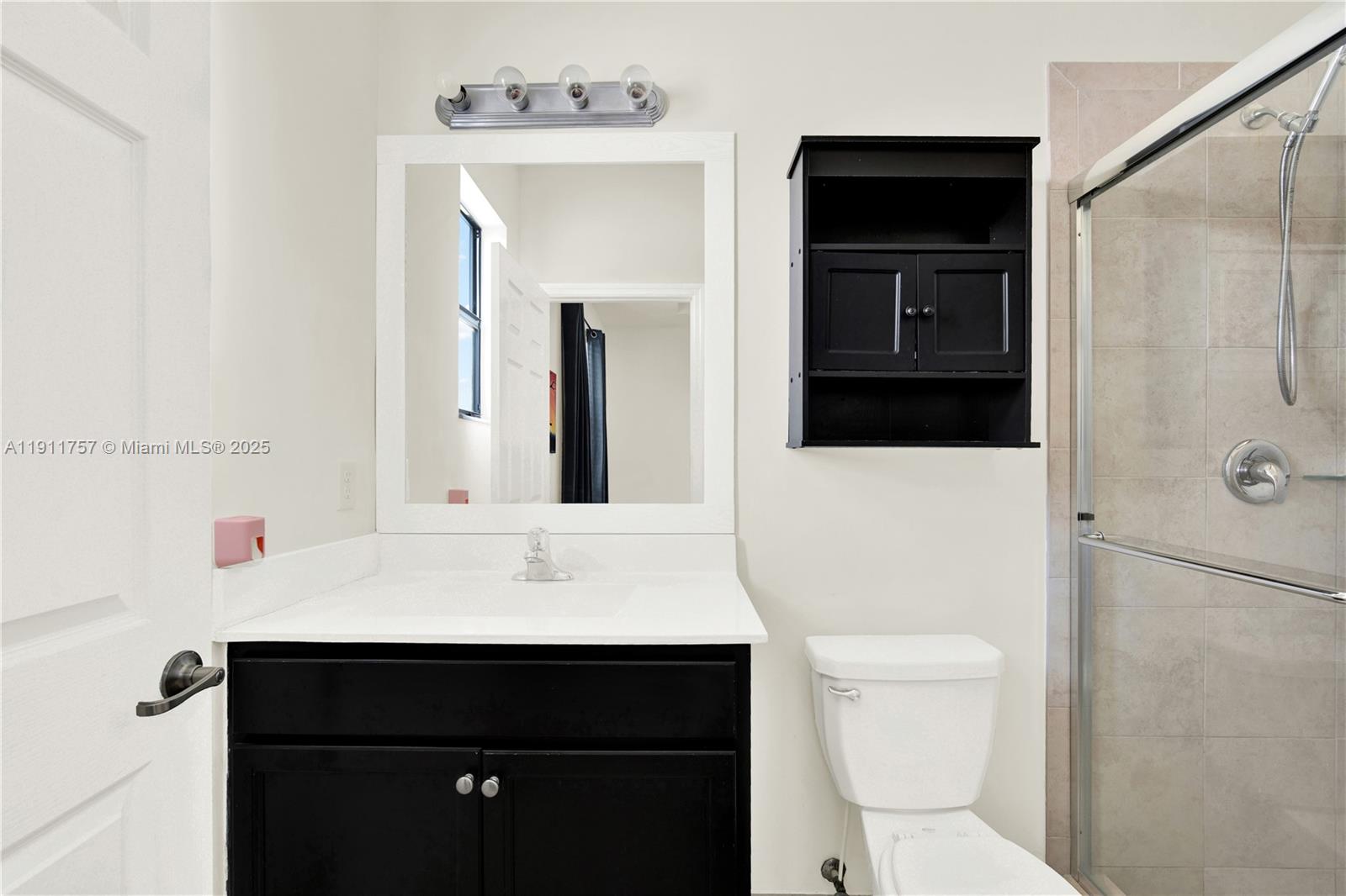 11411 Southwest 248th Lane Homestead, FL 33032 - Photo 22 of 40 a bathroom with a sink a toilet and shower