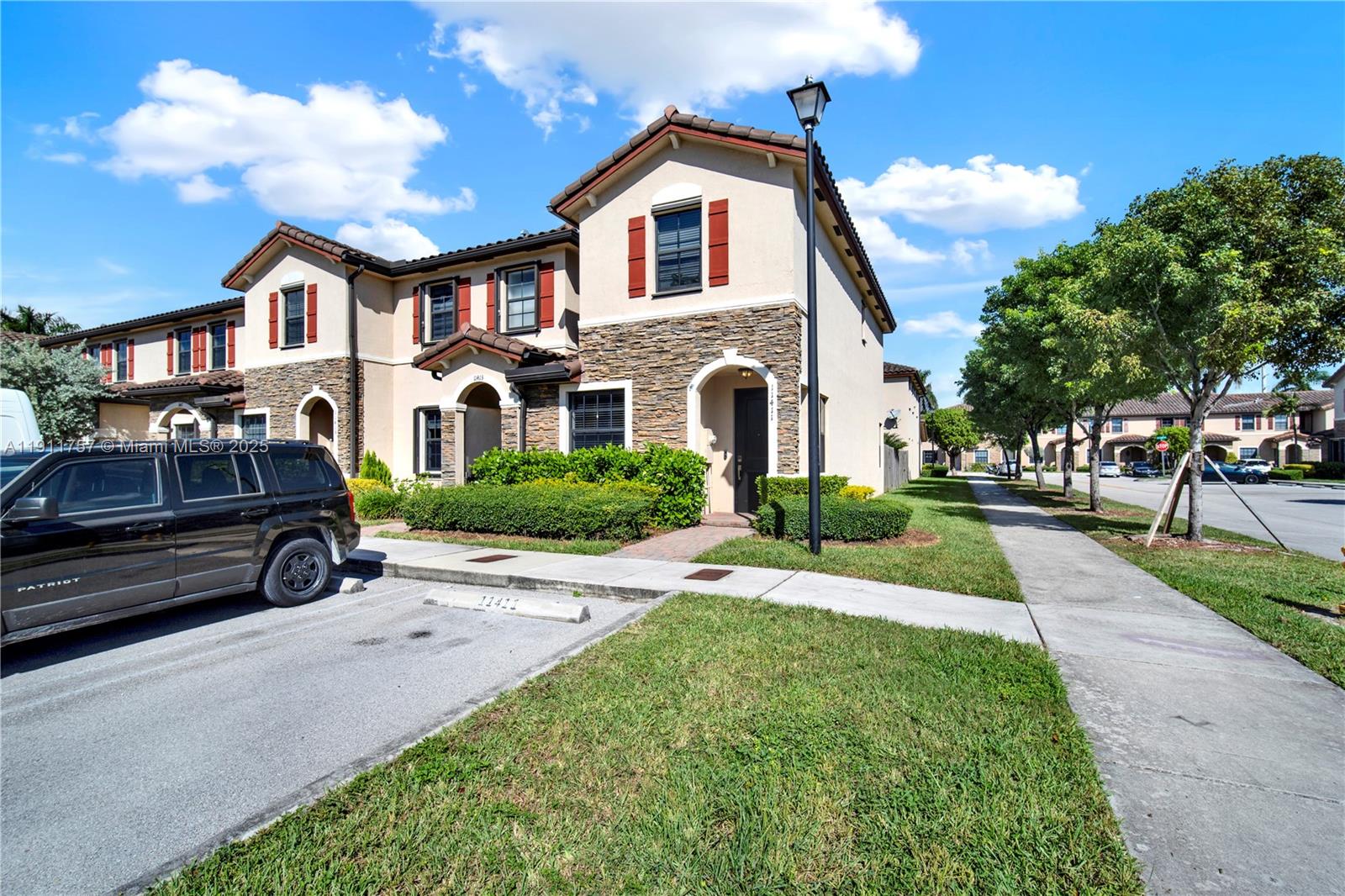 11411 Southwest 248th Lane Homestead, FL 33032 - Photo 3 of 40 a car parked in front of a house
