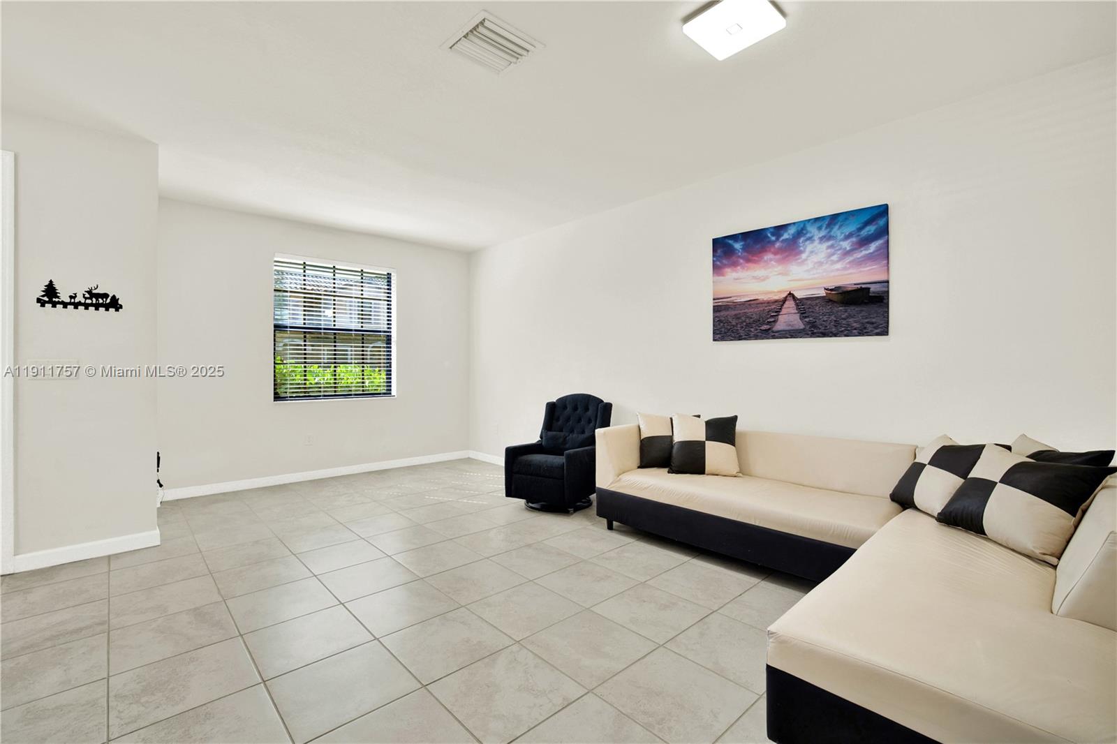 11411 Southwest 248th Lane Homestead, FL 33032 - Photo 6 of 40 a living room with furniture and a window