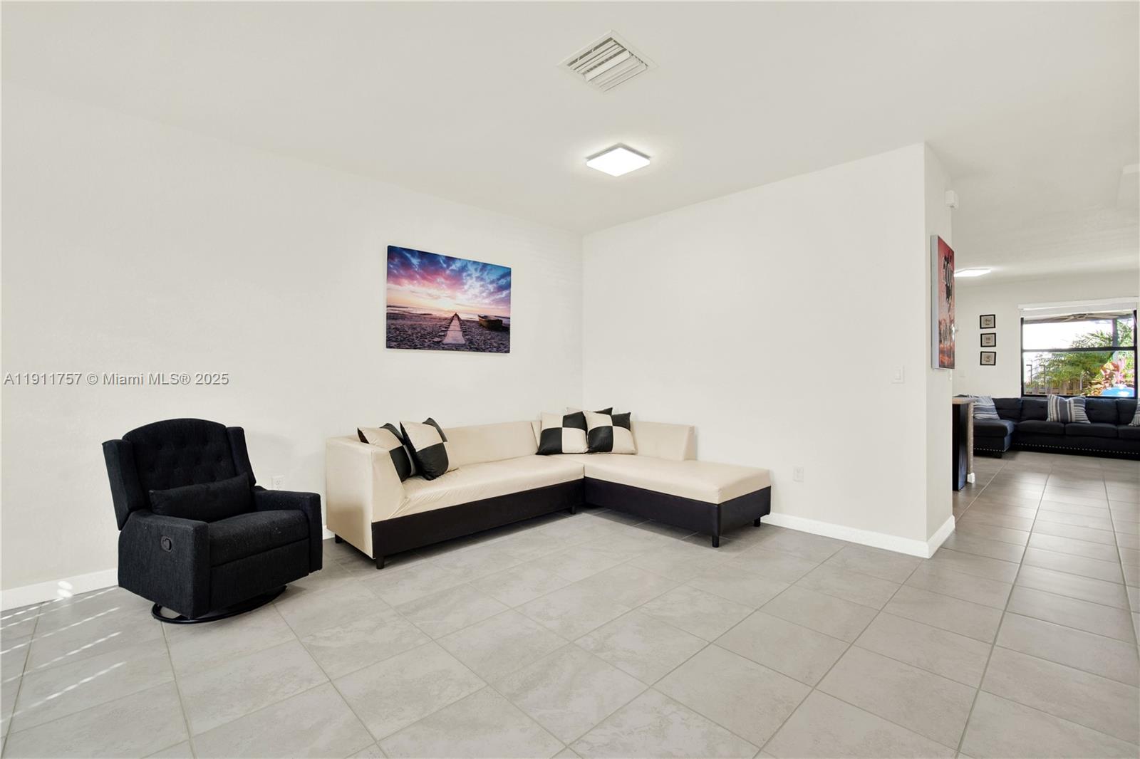 11411 Southwest 248th Lane Homestead, FL 33032 - Photo 7 of 40 a living room with furniture and a couch