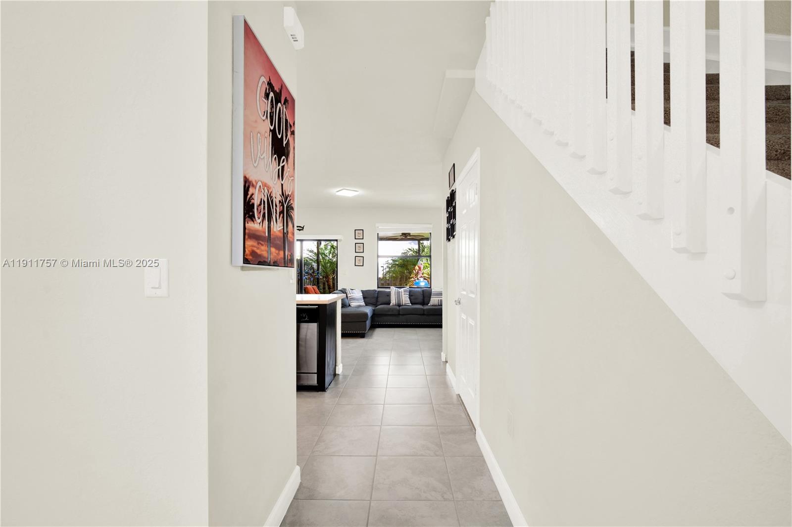 11411 Southwest 248th Lane Homestead, FL 33032 - Photo 8 of 40 a view of a living room with furniture and a hallway