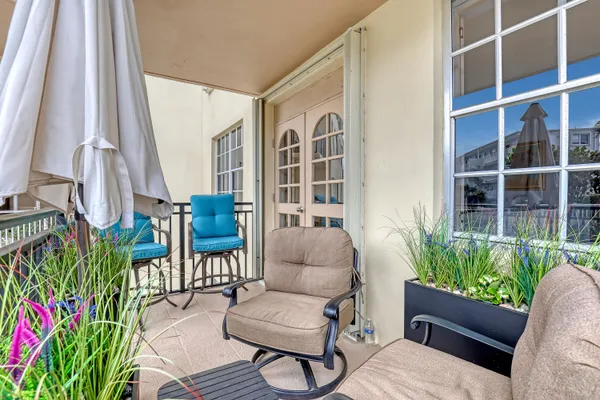 a outdoor living space with furniture and a potted plant