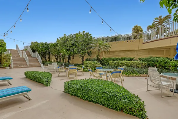 a view of a garden with sitting area