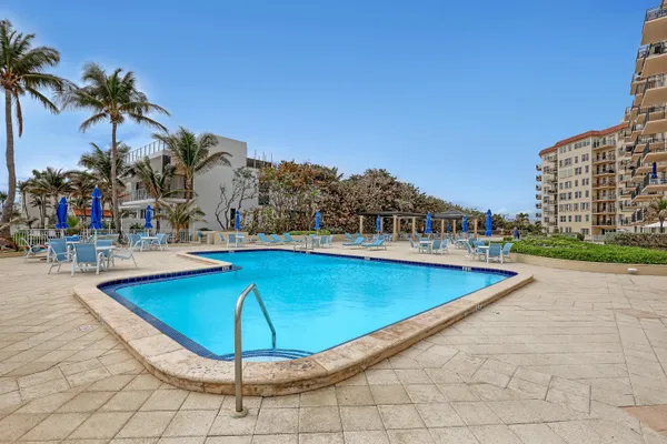a view of a swimming pool with a lounge chairs