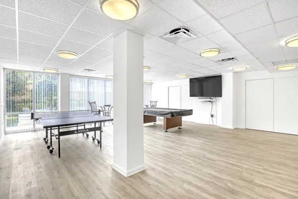 a view of a livingroom with furniture and a flat screen tv
