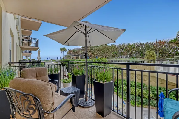 a view of a balcony with furniture