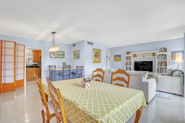 a bed room with furniture and a flat screen tv