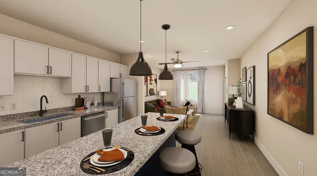a kitchen with stainless steel appliances granite countertop a sink and a refrigerator