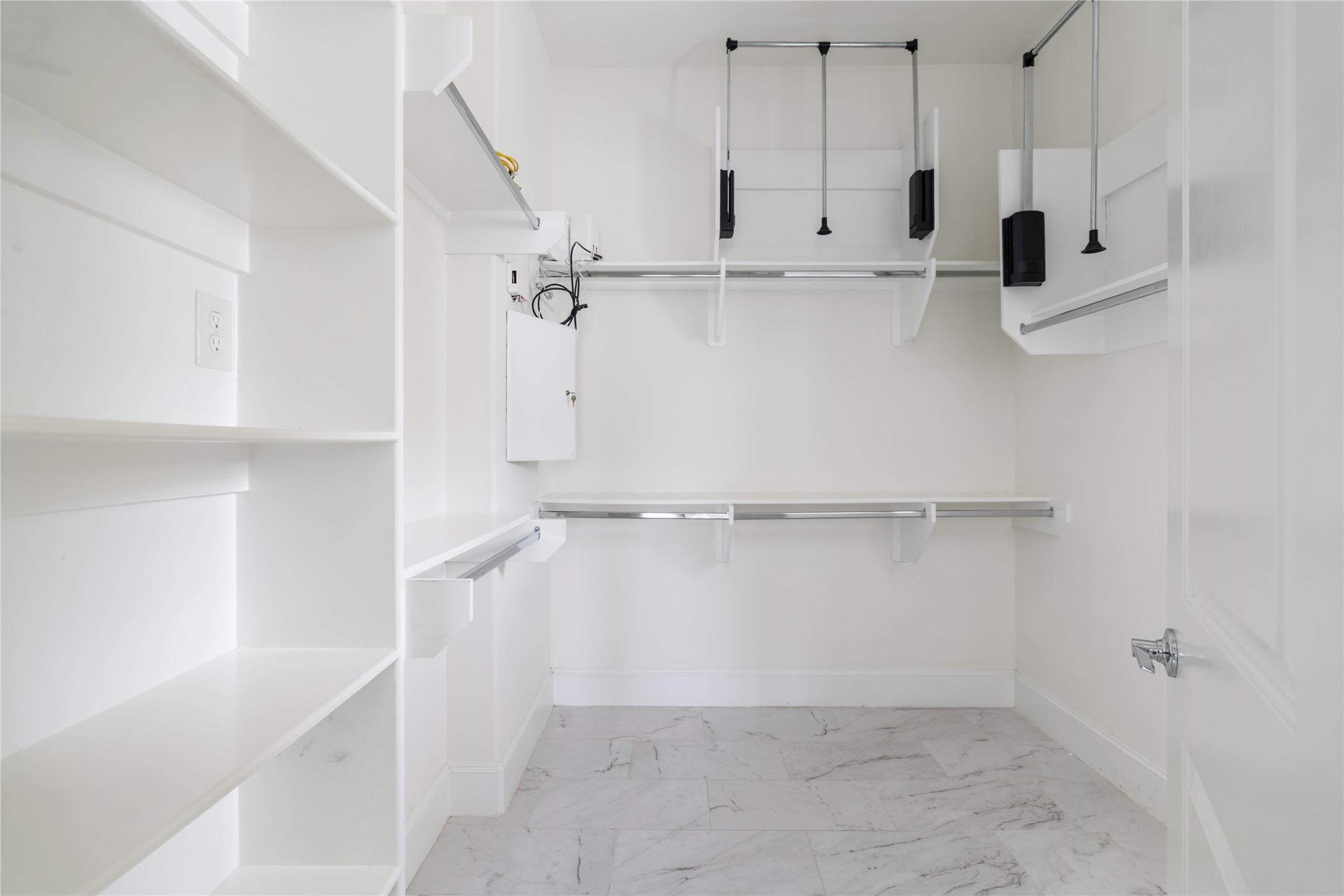 2613 Maxroy Street Houston, TX 77007 - Photo 26 of 43 The primary features a true showpiece closet with custom built-ins, ample hanging space, and dedicated shelving for shoes and accessories.
