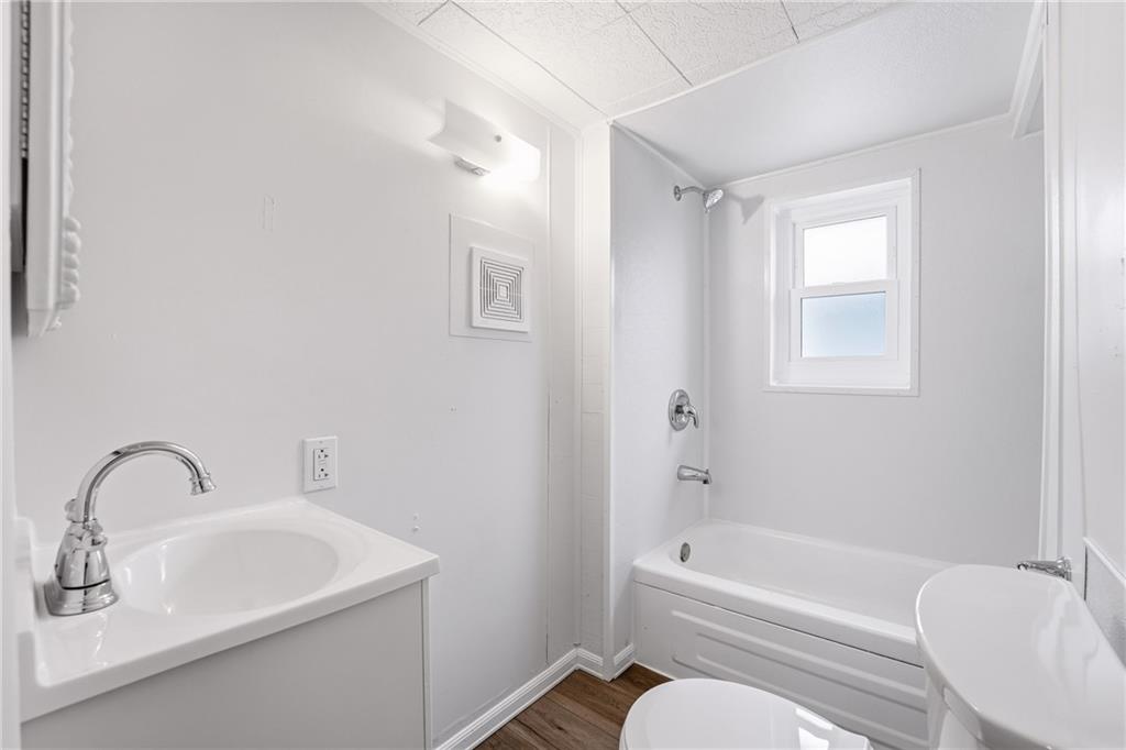 315 Mitchell Avenue Butler, PA 16001 - Photo 15 of 19 a bathroom with a sink toilet and bathtub