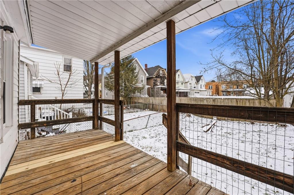 315 Mitchell Avenue Butler, PA 16001 - Photo 19 of 19 a view of a balcony with wooden floor and bench