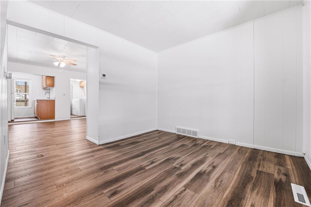 315 Mitchell Avenue Butler, PA 16001 - Photo 6 of 19 a view of a room with wooden floor and stairs