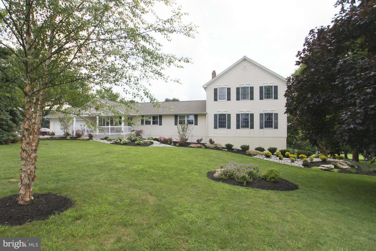 21107 Gunpowder Road Manchester, MD 21102 - Photo 1 of 30 a front view of a house with a garden