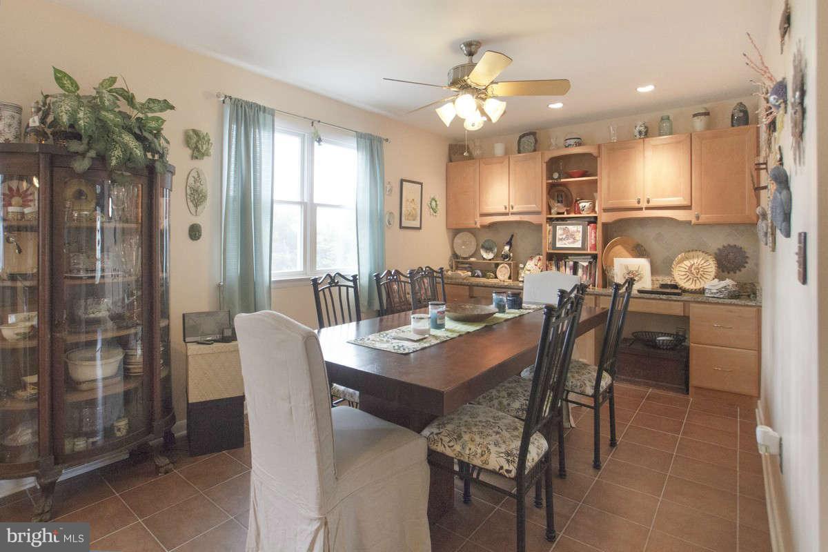 21107 Gunpowder Road Manchester, MD 21102 - Photo 11 of 30 a dining room with furniture a window and kitchen view
