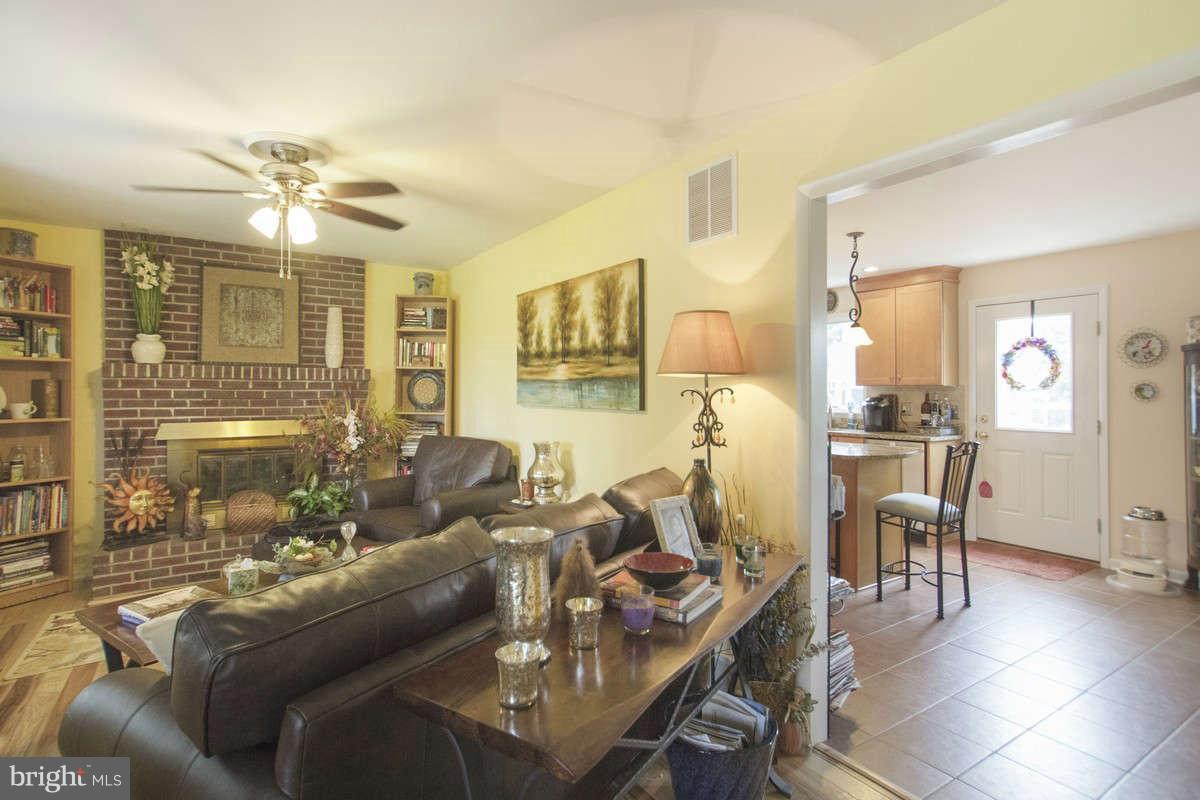 21107 Gunpowder Road Manchester, MD 21102 - Photo 12 of 30 a living room with furniture and a chandelier