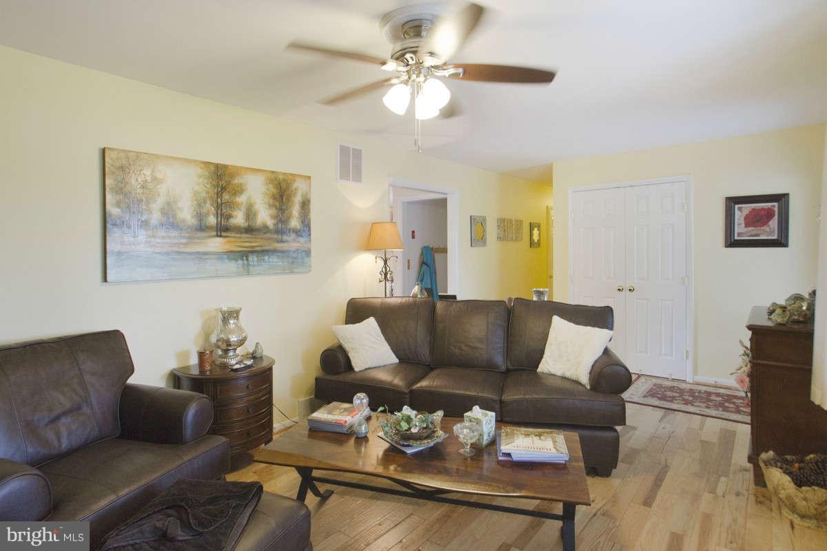 21107 Gunpowder Road Manchester, MD 21102 - Photo 13 of 30 a living room with furniture and a chandelier
