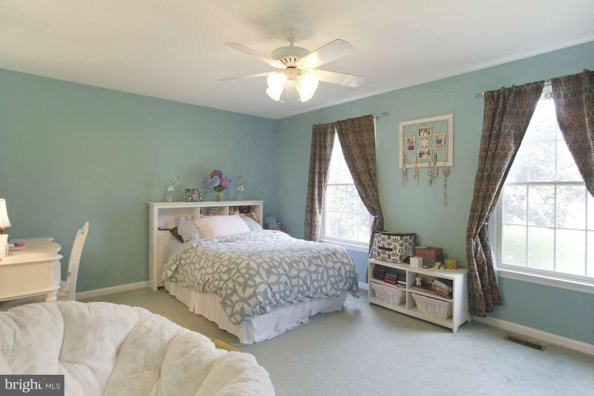 21107 Gunpowder Road Manchester, MD 21102 - Photo 16 of 30 a bedroom with a bed and a window