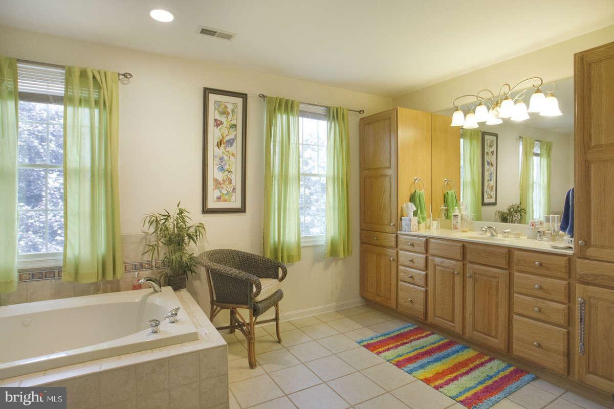 21107 Gunpowder Road Manchester, MD 21102 - Photo 21 of 30 a spacious bathroom with a tub sink and mirror