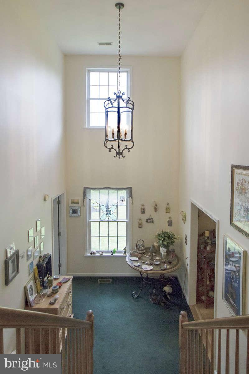 21107 Gunpowder Road Manchester, MD 21102 - Photo 22 of 30 a dining room with furniture a chandelier and window
