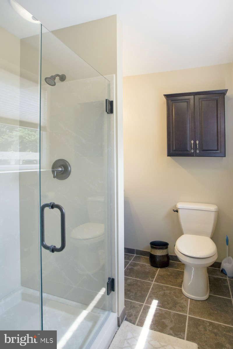 21107 Gunpowder Road Manchester, MD 21102 - Photo 24 of 30 a bathroom with a toilet and a shower