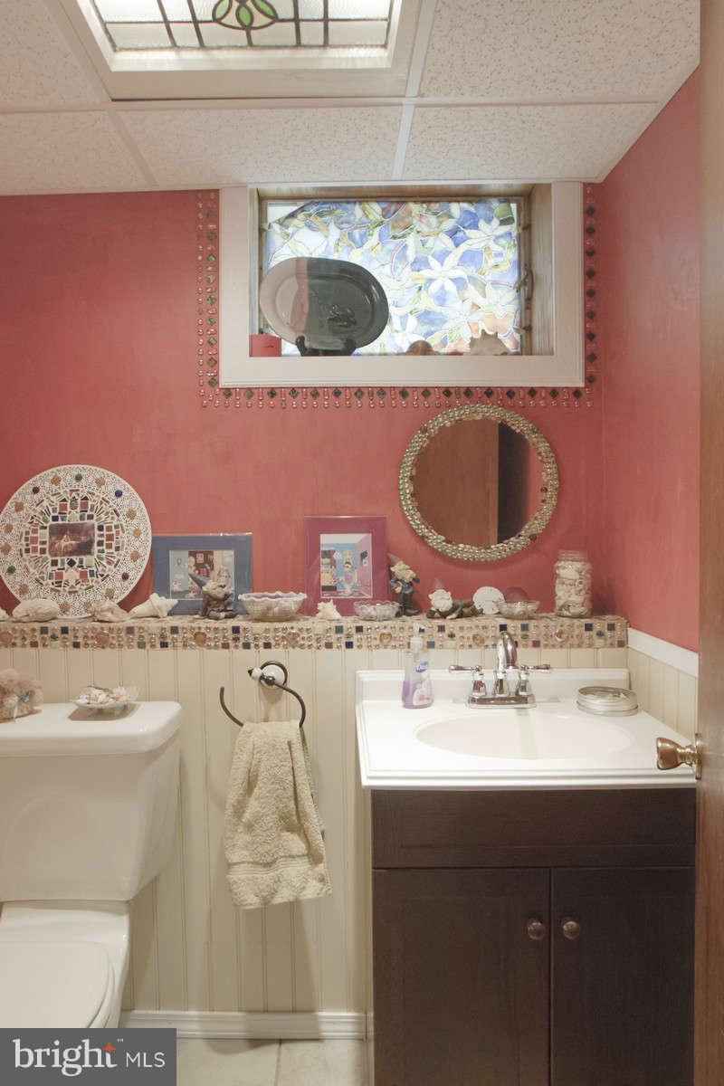 21107 Gunpowder Road Manchester, MD 21102 - Photo 25 of 30 a bathroom with a sink a mirror and bathtub