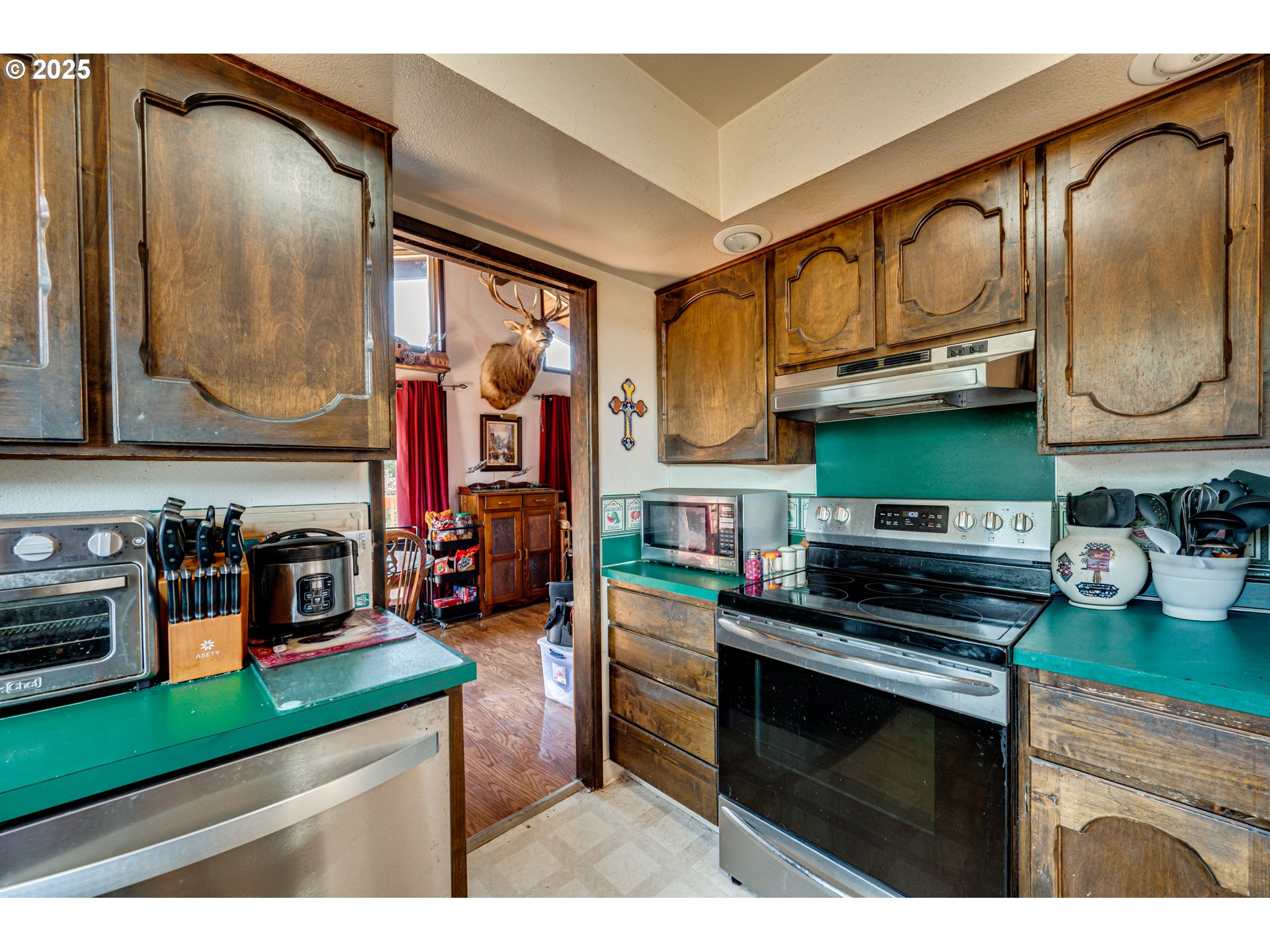1415 Cloverdale Road Kalama, WA 98625 - Photo 14 of 39 a kitchen with stainless steel appliances granite countertop a stove and cabinets