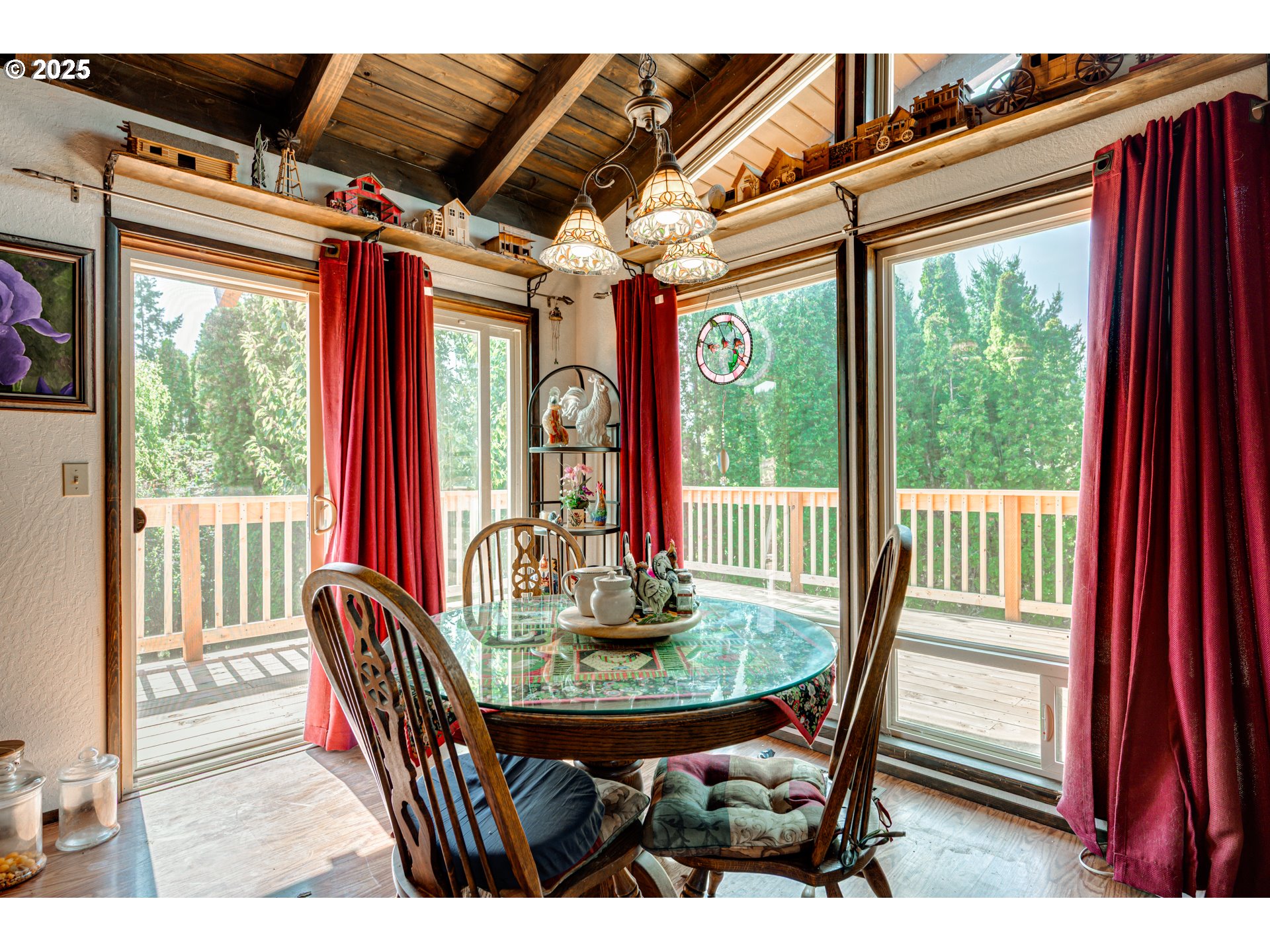 1415 Cloverdale Road Kalama, WA 98625 - Photo 15 of 39 a view of a dining room with furniture wooden floor and a potted plant
