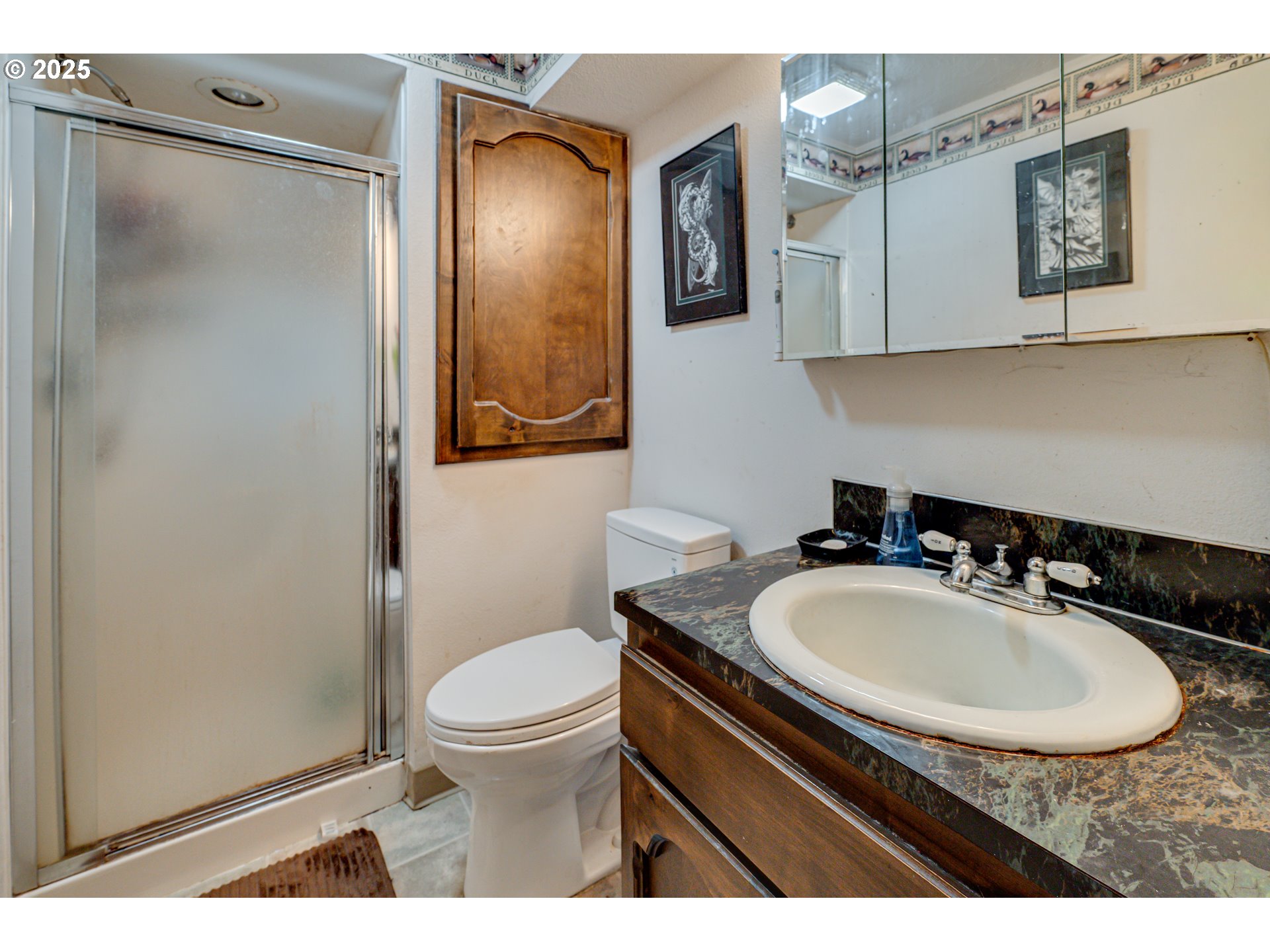 1415 Cloverdale Road Kalama, WA 98625 - Photo 19 of 39 a bathroom with a sink a toilet and mirror