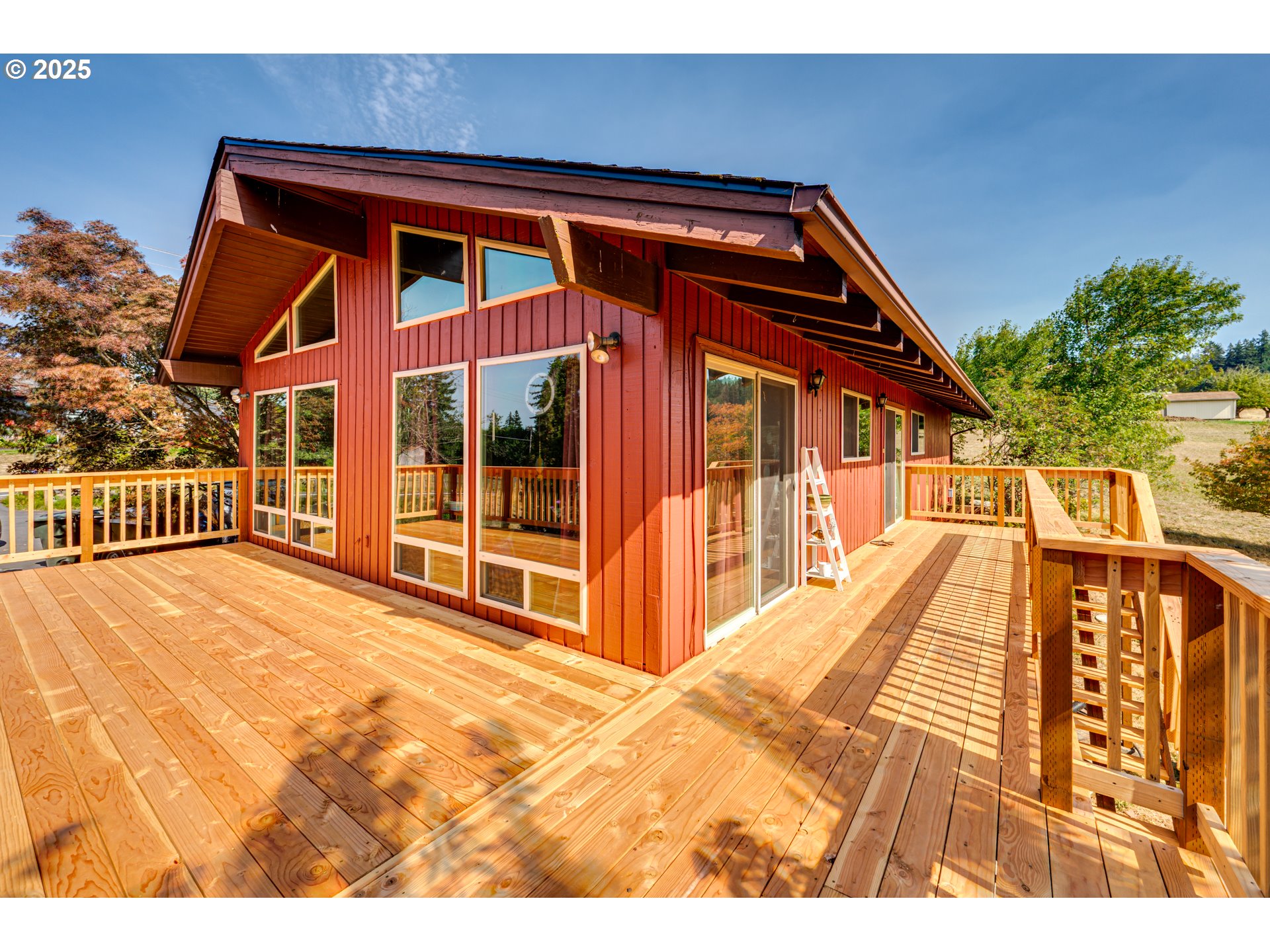1415 Cloverdale Road Kalama, WA 98625 - Photo 3 of 39 a view of front of house with wooden deck