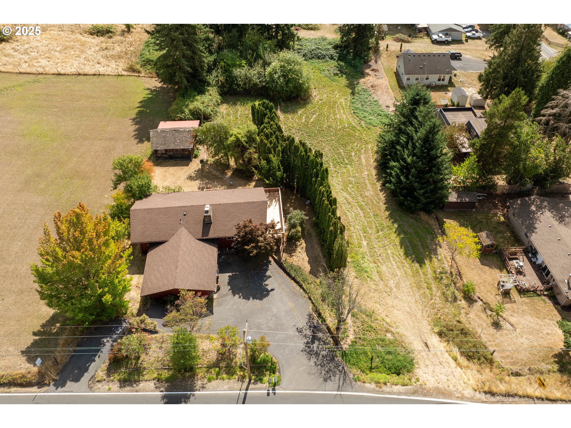 1415 Cloverdale Road Kalama, WA 98625 - Photo 37 of 39 a aerial view of a house with a yard and lake view